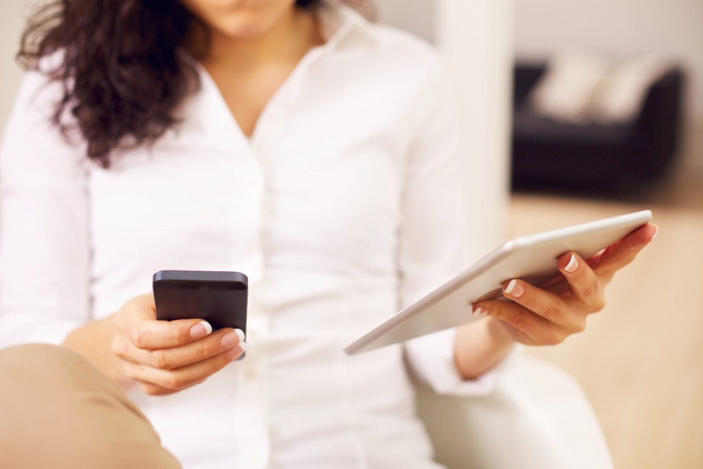 Modern Woman with a Smartphone and Tablet