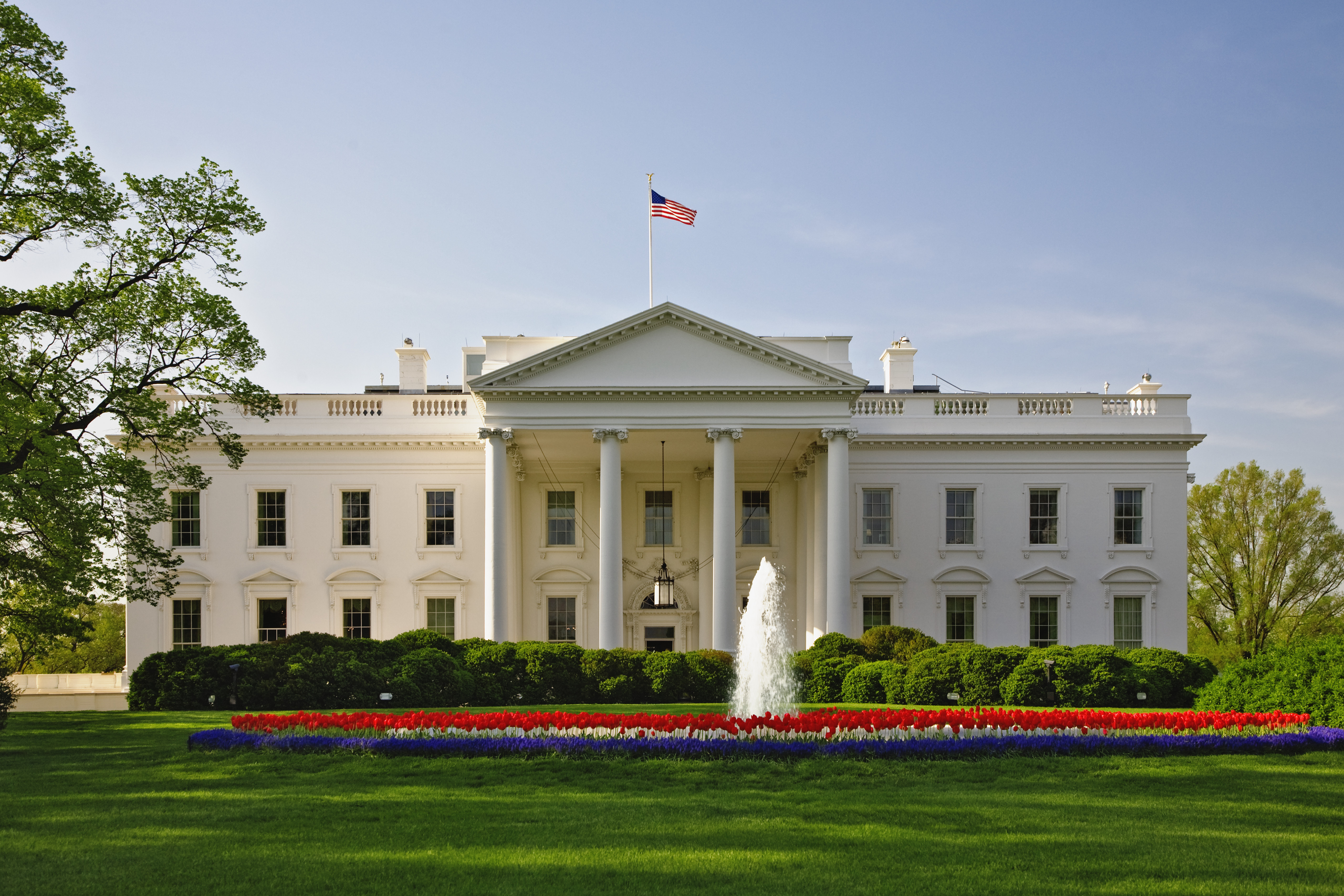 1792, Washington, DC, USA --- The White House as seen from Pennsylvania Avenue. The White House was built from the design submitted by Irishman James Hoban. The corner stone was laid on October 13, 1792. The footings for the main residence were dug by slaves and much of the work was performed by immigrants not yet citizens. John Adams was the first president to take residence in the White House on November 1, 1800. --- Image by © William Manning/Corbis